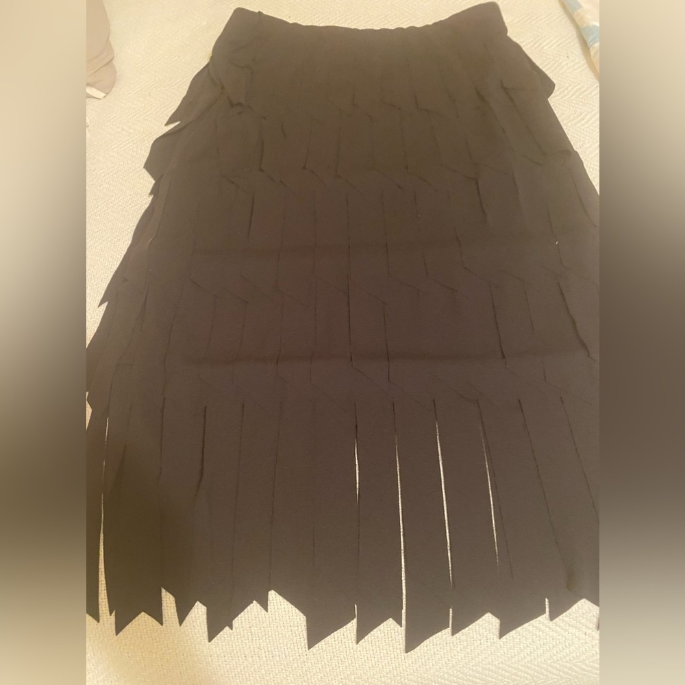 Classy wide fringed skirt with elastic waist.